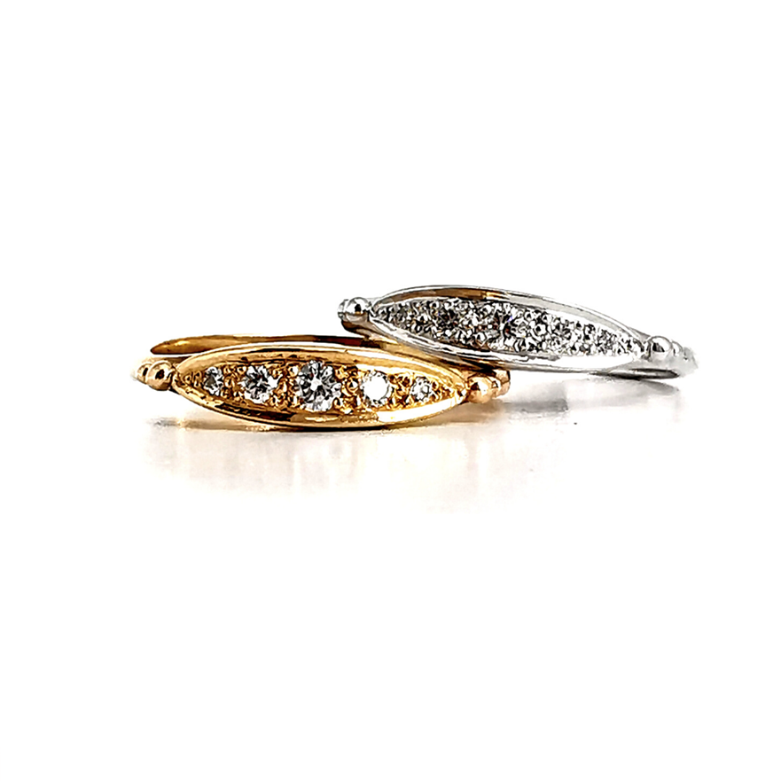 Ellipse design diamond band with five grain set diamonds in yellow and white gold, bands grouped together, Melbourne Australia