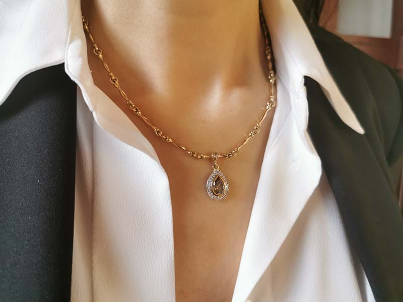 Model wearing Pear-drop cognac diamond necklace with hourglass handcrafted solid neckchain, yellow gold and white gold with diamond halo, jewellery, Melbourne, Australia